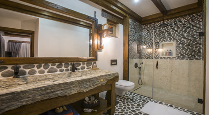 Natural Stone Bathroom Highlighting Handcrafted Wood Details at Gokce Gemile