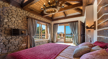 Stone-Walled Bedroom with Sea-View Terrace at Gokce Gemile Private Peninsula