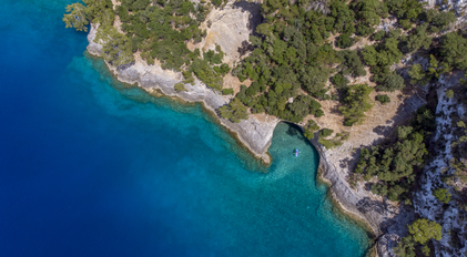 Aerial View of a Hidden Cave-Like Cove with Clear Turquoise Waters