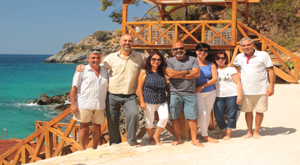 Gökçe Gemile Private Bay team portrait on the waterfront deck
