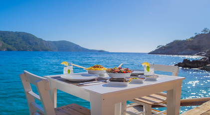 Private chef seaside lunch overlooking a calm Mediterranean bay in Turkey