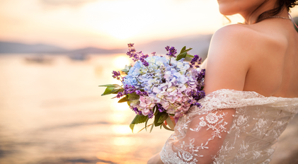 Bridal bouquet captured at sunset by the calm Mediterranean shoreline