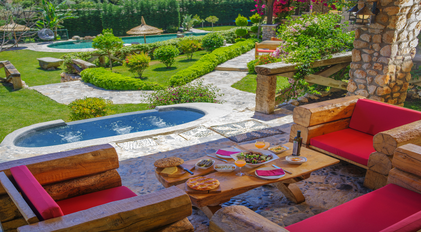 Garden wellness terrace overlooking calm green spaces and pools