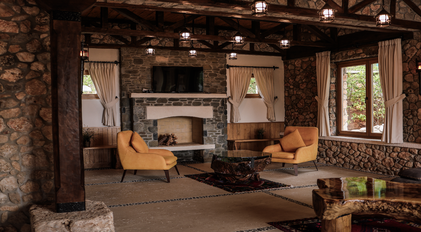 Stone living area with warm lighting and handcrafted rustic details