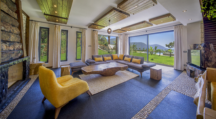 Bright living room with panoramic garden and Mediterranean sea views