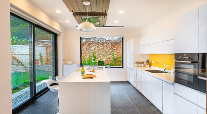 Bright modern kitchen with island and garden-view window