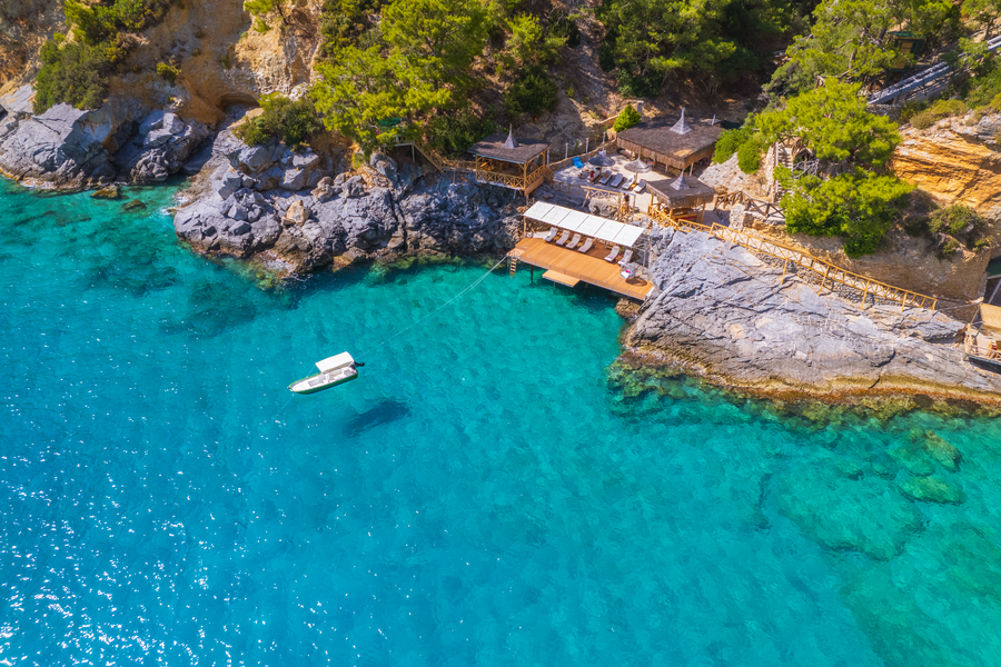 Aerial View of Waterfront Lounging Deck and Turquoise Mediterranean Bay