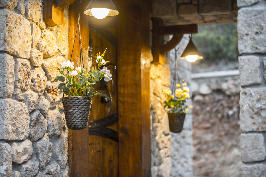 Warmly Lit Stone Entryway Reflecting Gokce Gemile’s Nature-Rooted Philosophy