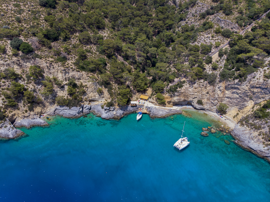 Aerial View of a Secluded Peninsula Bay with Beach Deck and Anchored Yachts