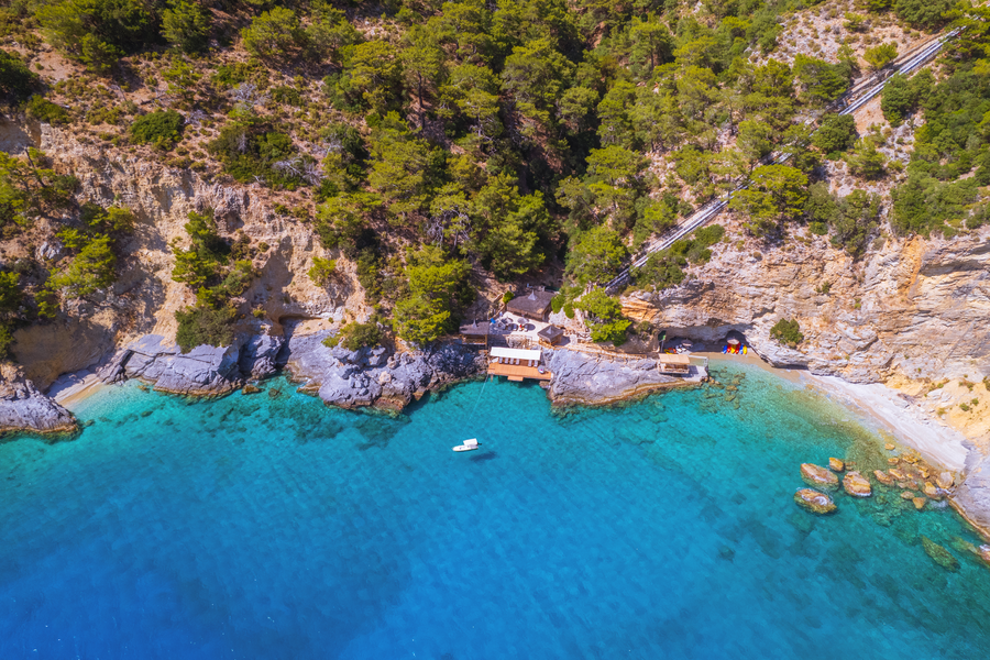 Aerial View of a Secluded Peninsula Bay with Beach Club and Funicular Line