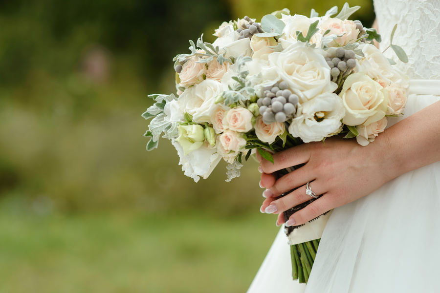 Elegant bridal bouquet captured in soft natural light on a Mediterranean peninsula