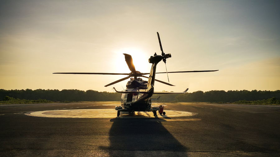 Luxury helicopter arrival service at sunset