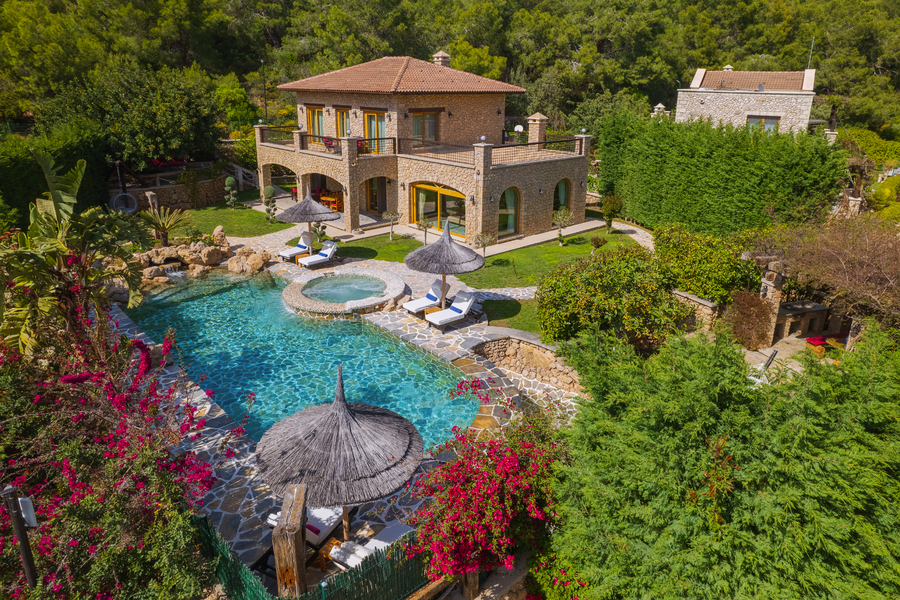 Aerial view of Villa Elmalı with lagoon-style pool and stone architecture