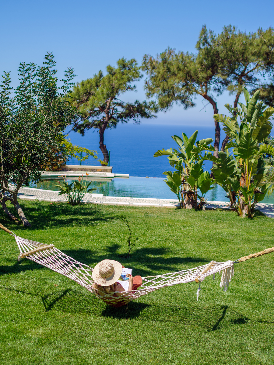 Hammock view facing tropical gardens, infinity pool and the Mediterranean horizon