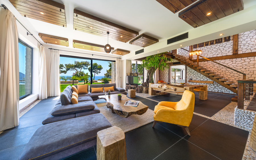 Rustic living room with panoramic nature and sea views