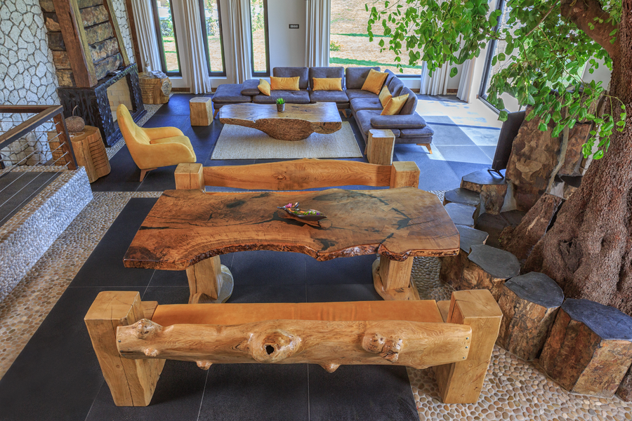 Rustic living room with natural wood furniture and garden-facing lounge area